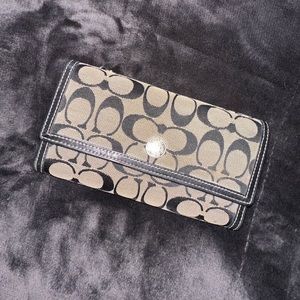 black canvas and leather coach wallet with leather check book
